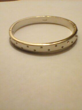 Silver tone hinged bangle bracelet by Monet.